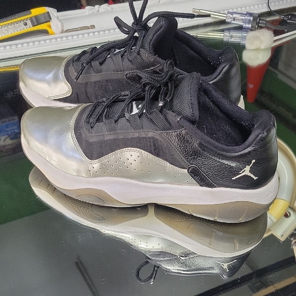 Women's 9.5 Jordan 11 CMFT Low 'Silver Toe' sneakers in black, white, & Silver